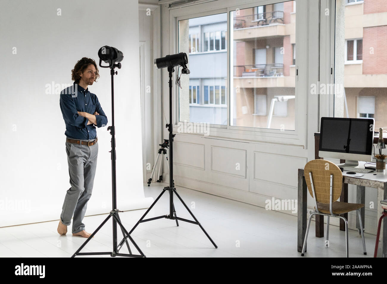 Photographer standing in his studio Stock Photo