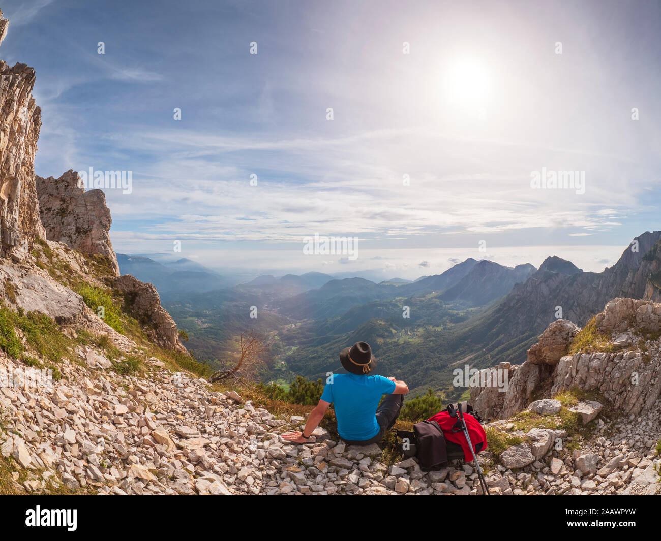 Hiker looking at view in the mountains, Recoaro Terme, Veneto, Italy Stock Photo