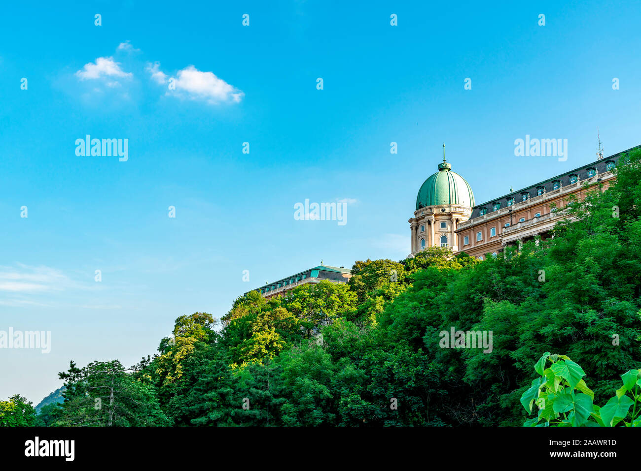 Low angle view of Royal Palace of Buda against blue sky at Budapest, Hungary Stock Photo