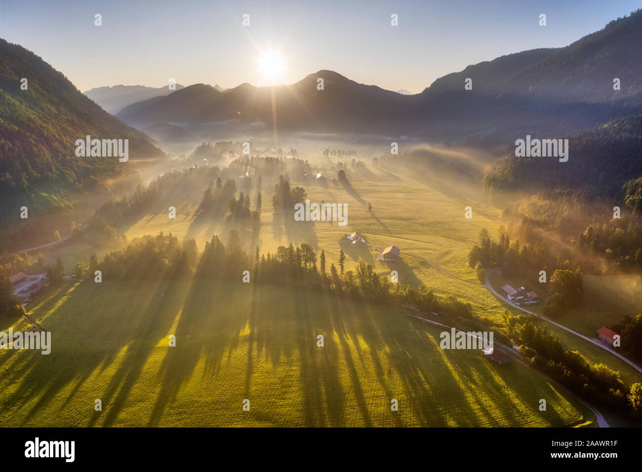 Germany, Bavaria, Upper Bavaria, Isarwinkel, Jachenau, rural landscape in fog at sunrise Stock Photo