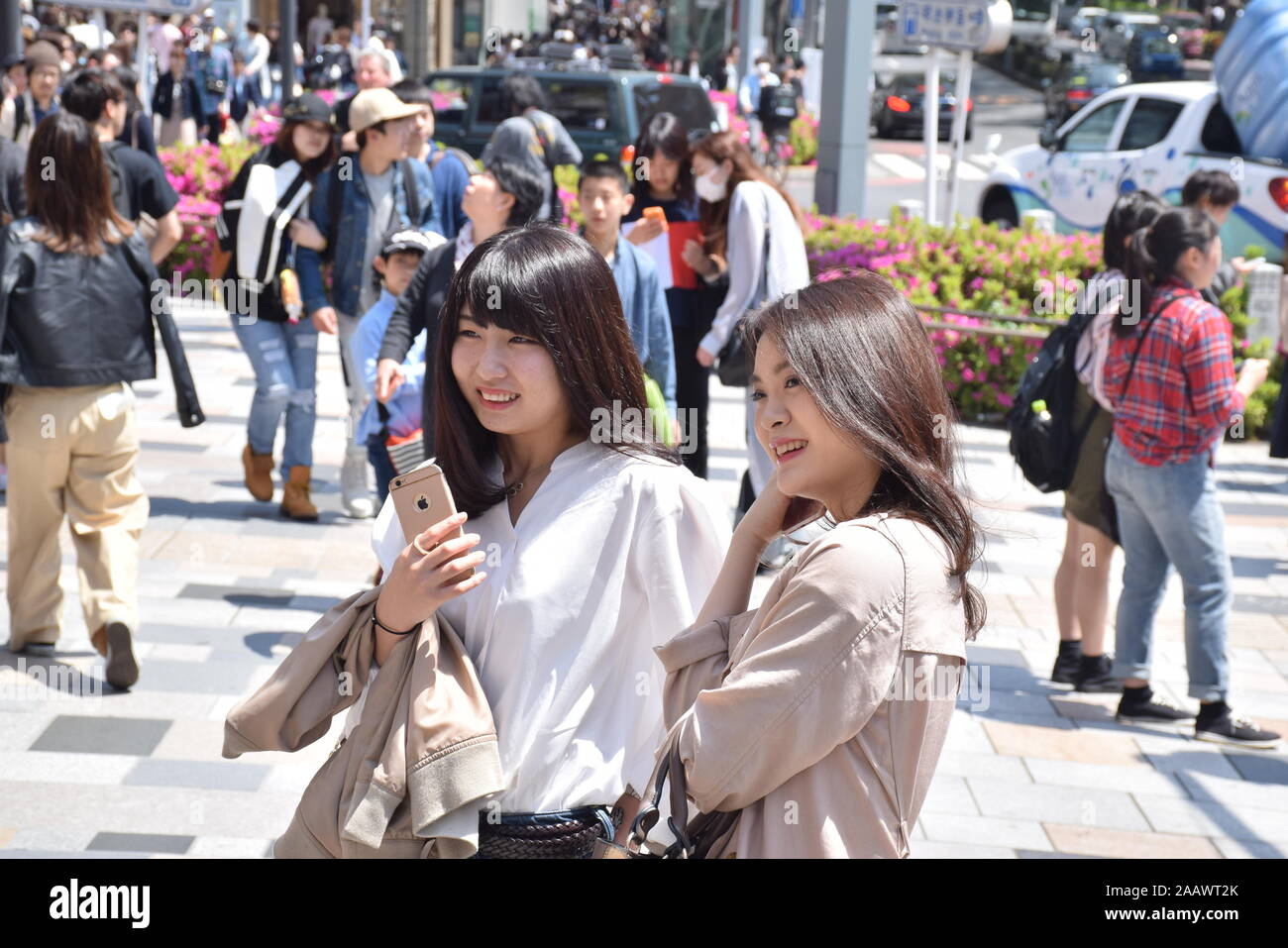 Two beautiful japanese girls on the streets of Omotesando district in Tokyo, Japan Stock Photo