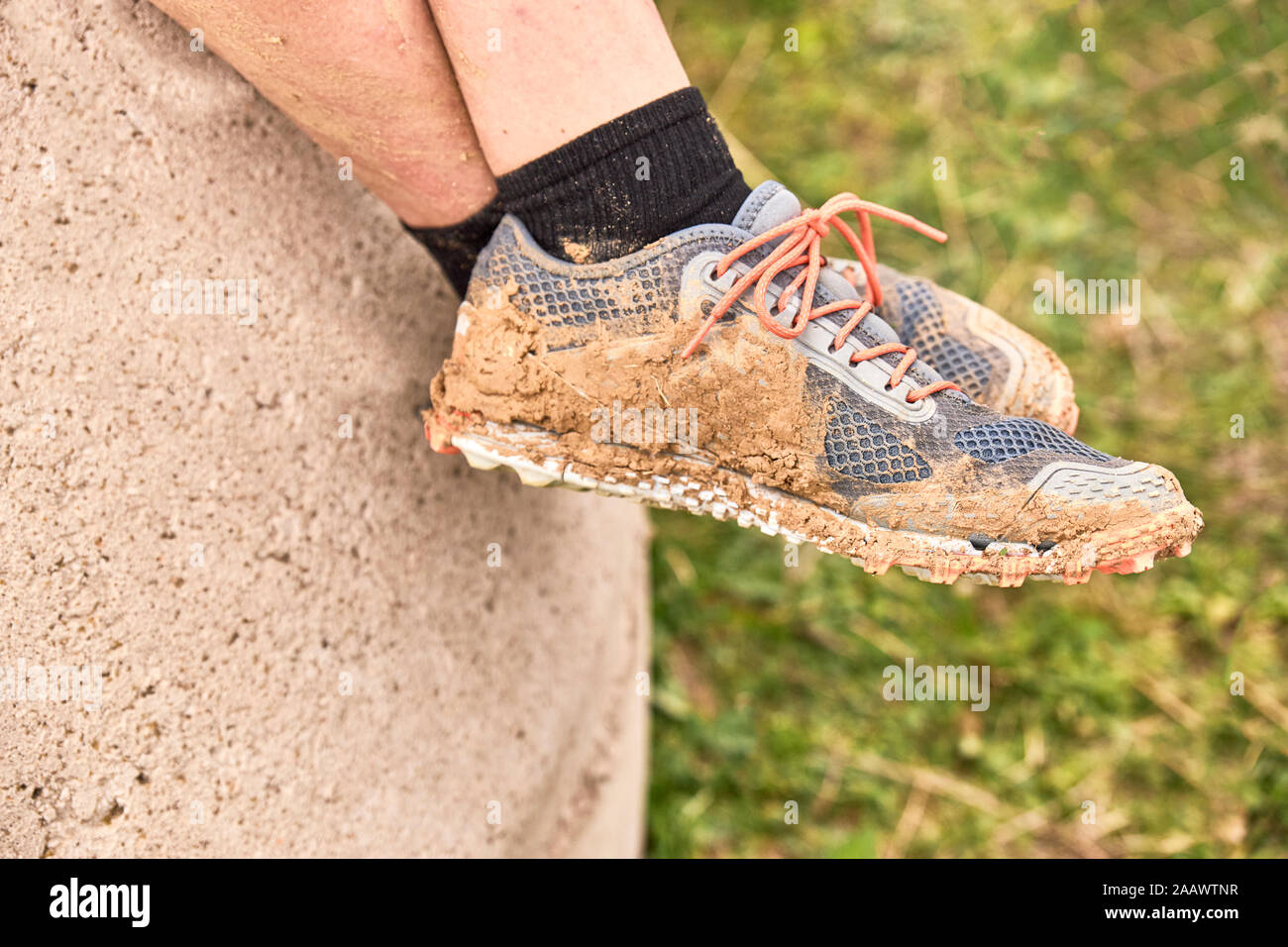 Slippers filled with mud after a Spartan race - Extreme sports concept  Stock Photo - Alamy