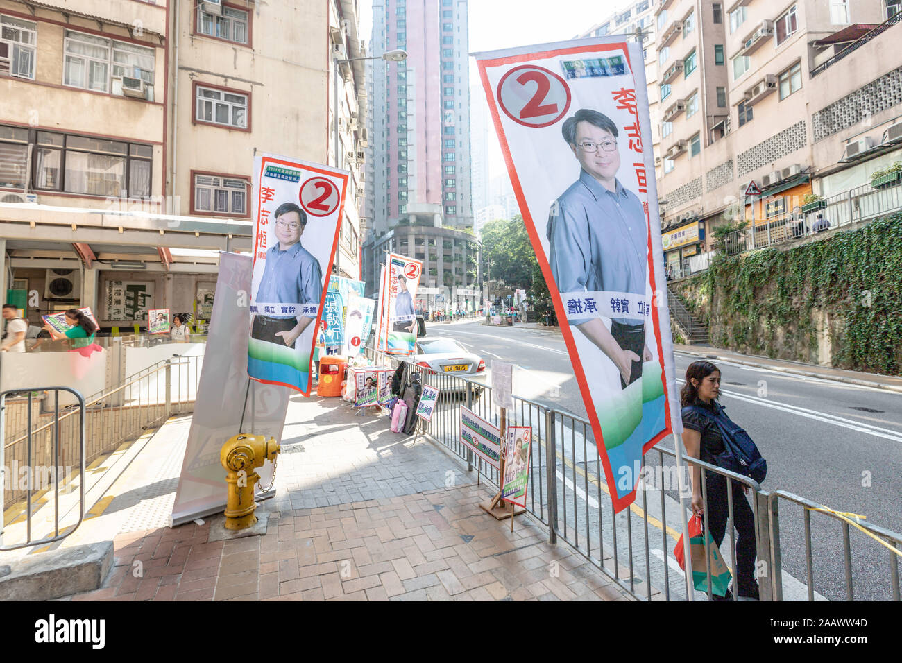 Election banners in one of the most competitive District Council.Hong Kong voters queue up by the hundreds at local polling stations for district council elections, citing concerns from both pro-democracy and pro-establishment camps that voting could be halted later in the day. Against the backdrop of continuing social unrest that has paralyzed the city since June, Hong Kong is expecting one of the largest turn out of voters since the establishment of the special administrative region. Stock Photo