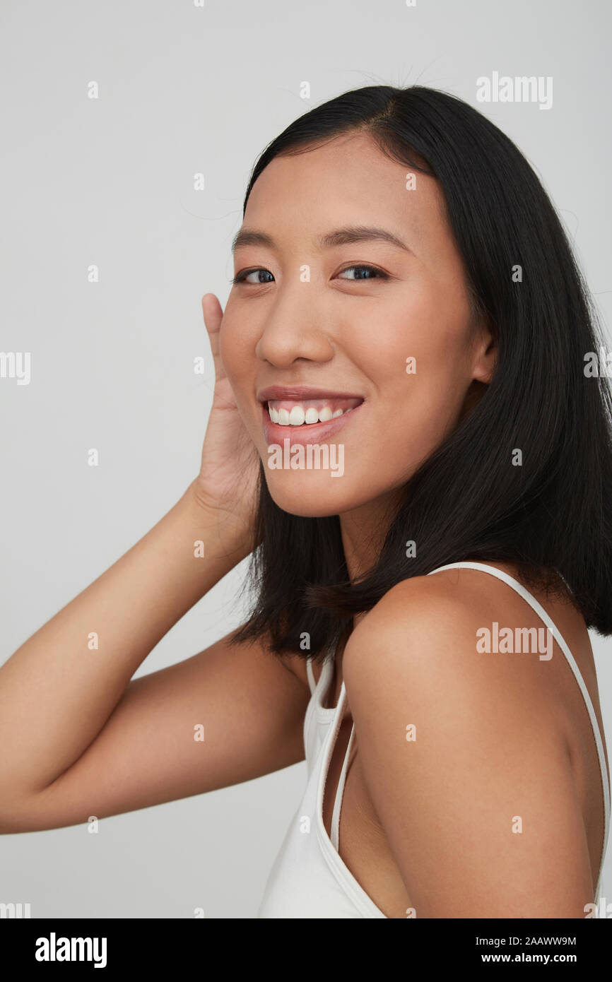 Portrait of young smiling female Chinese woman Stock Photo