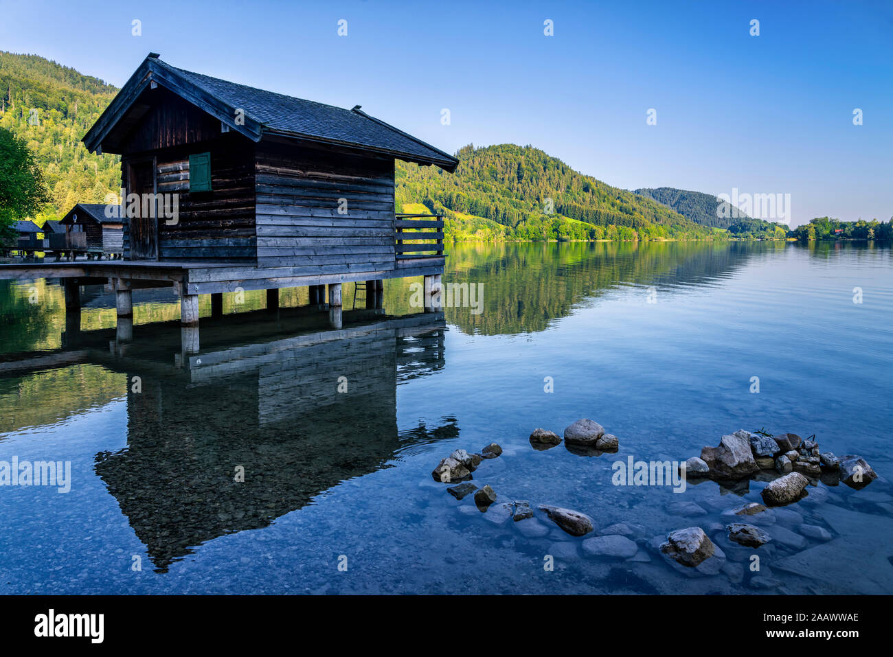 Boathouse at Schliersee lake against clear sky, Mangfallgebirge, Germany Stock Photo