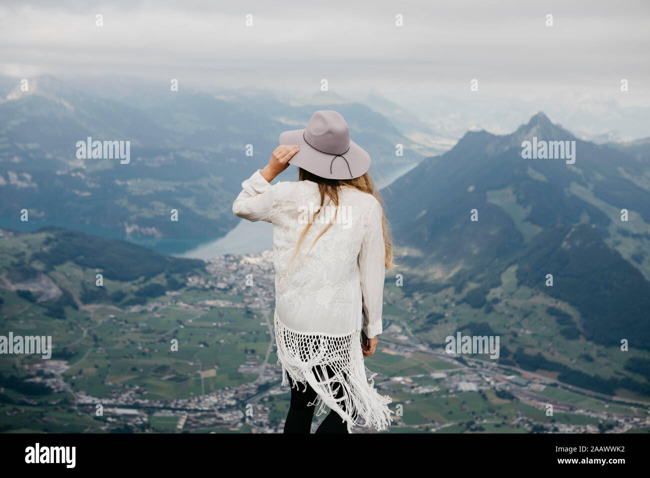Rear view of woman on viewpoint, Grosser Mythen, Switzerland Stock Photo