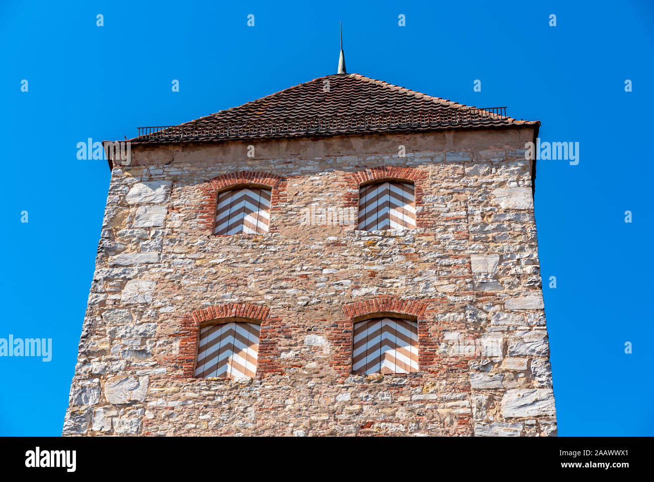 Low angle view of medieval tower against clear blue sky at Bavaria, Germany Stock Photo
