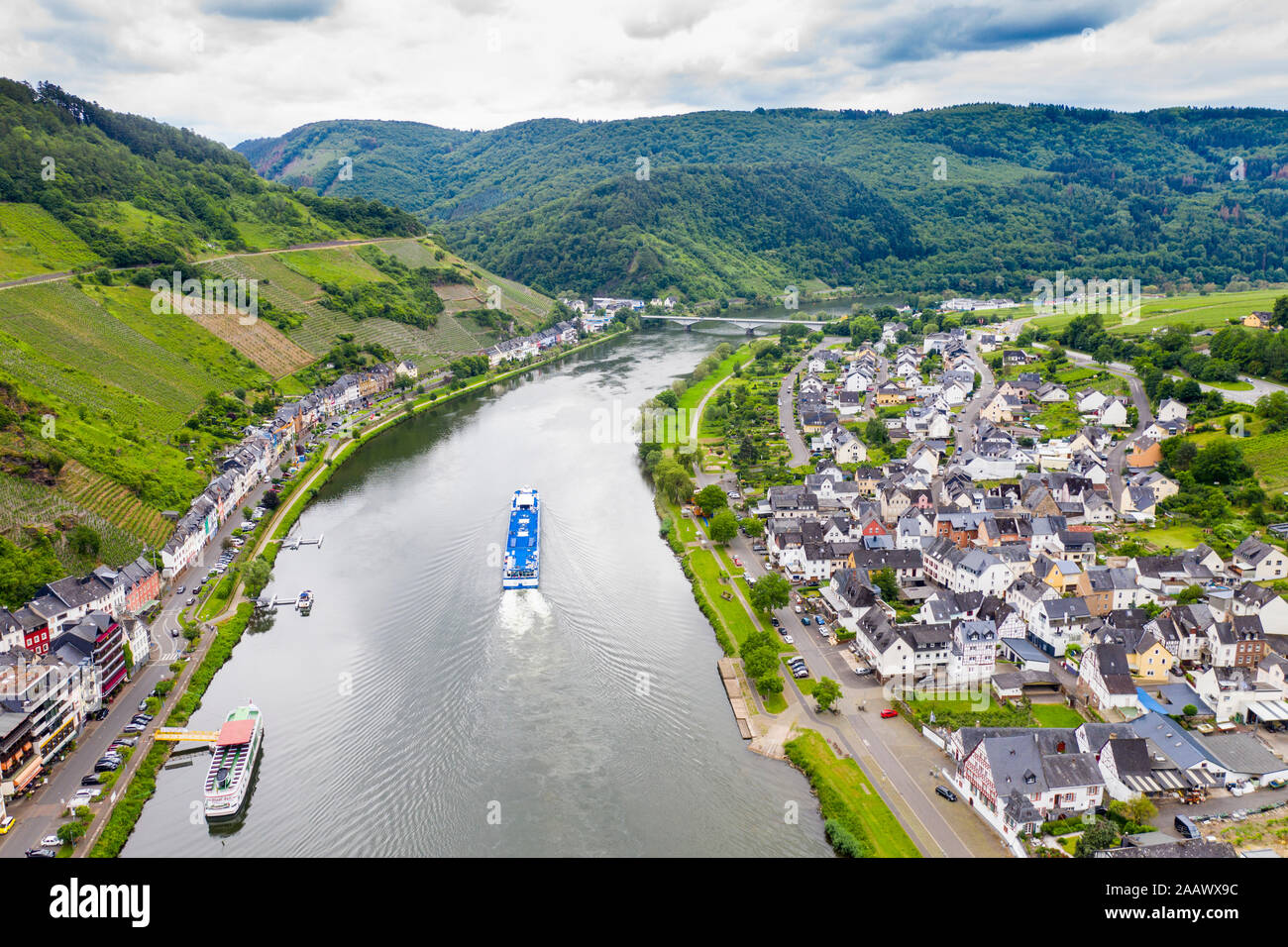 Drone shot of cruise ship on Mosel River against cloudy sky, Zell, Germany Stock Photo