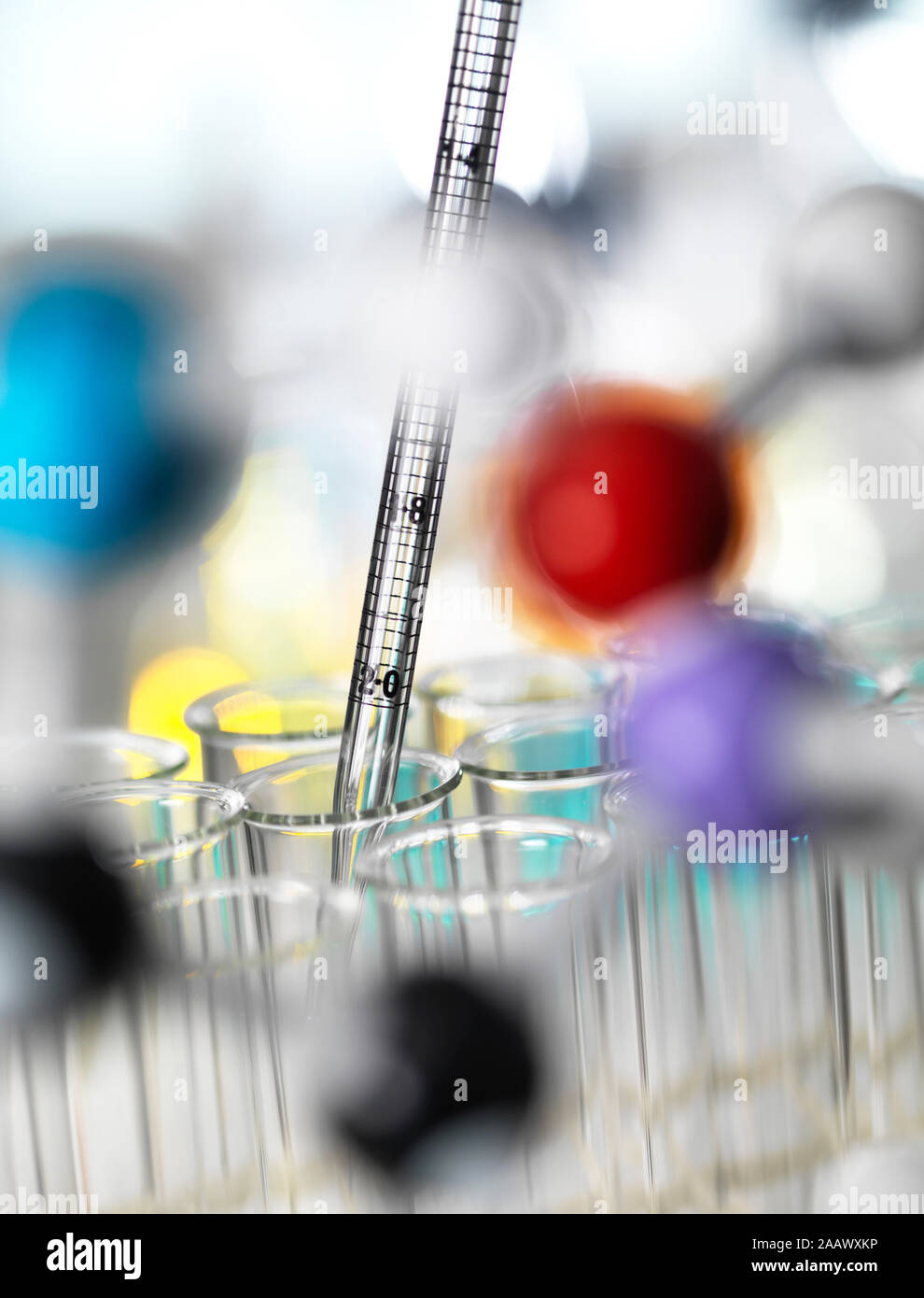 Close-up of chemical samples pipetting in test tubes for experiment at laboratory Stock Photo
