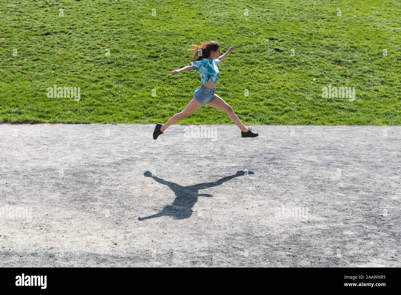 Woman running hands in air hi-res stock photography and images - Alamy