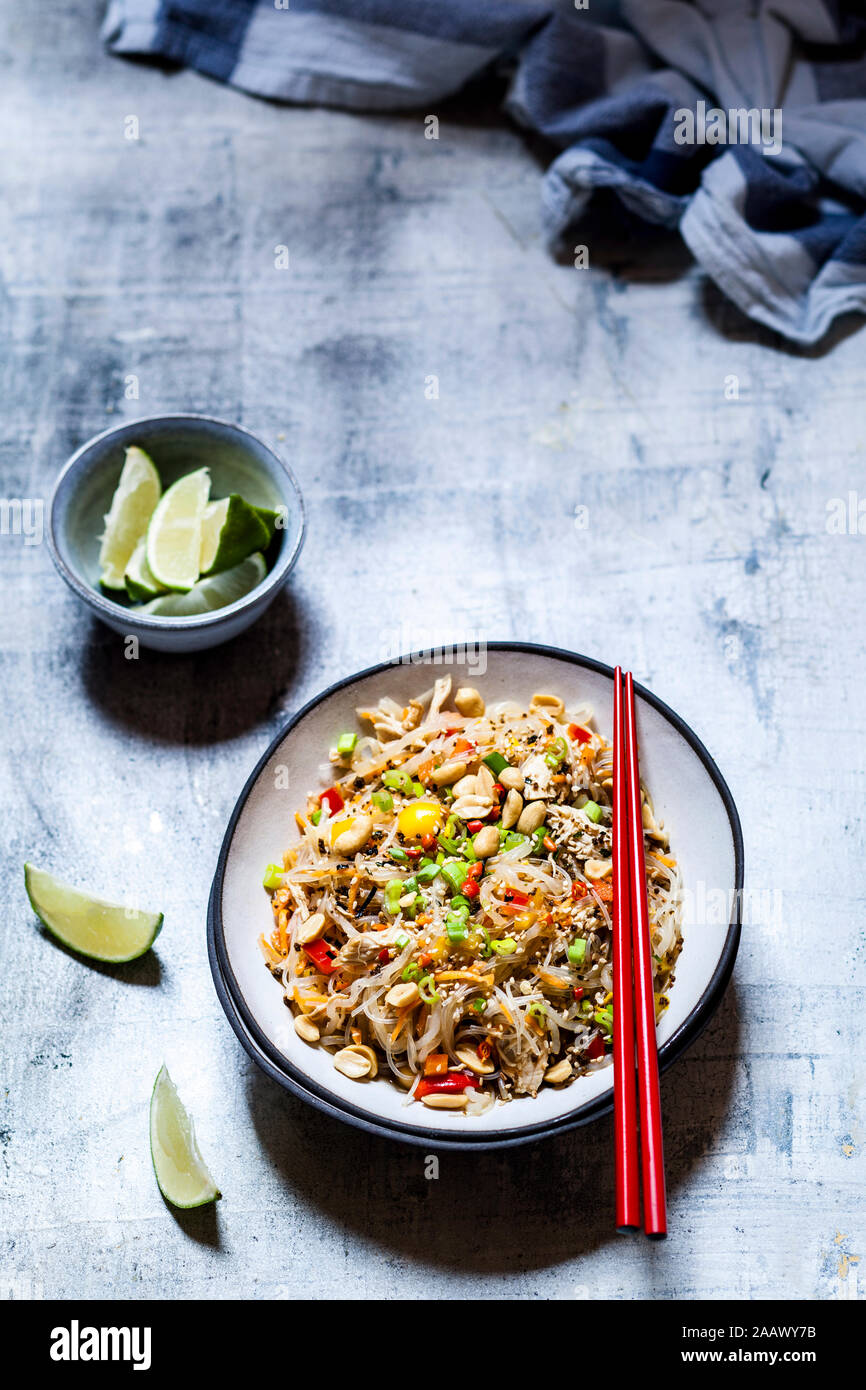 Glass noodle salad with Thai dressing, vegetables and chicken Stock Photo