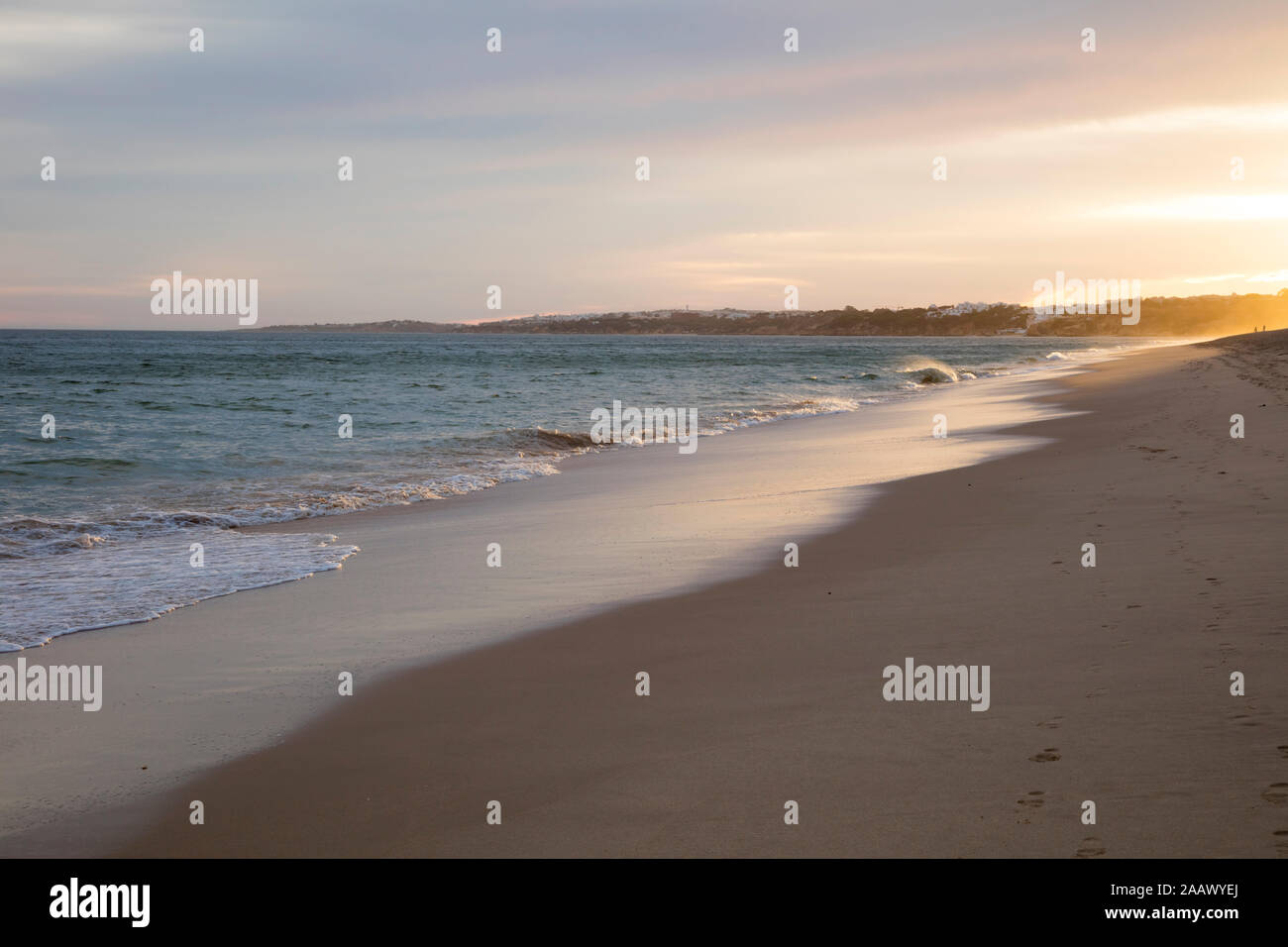 Scenic view of beach against sky during sunset, Atlantic Coast, Algarve, Portugal Stock Photo
