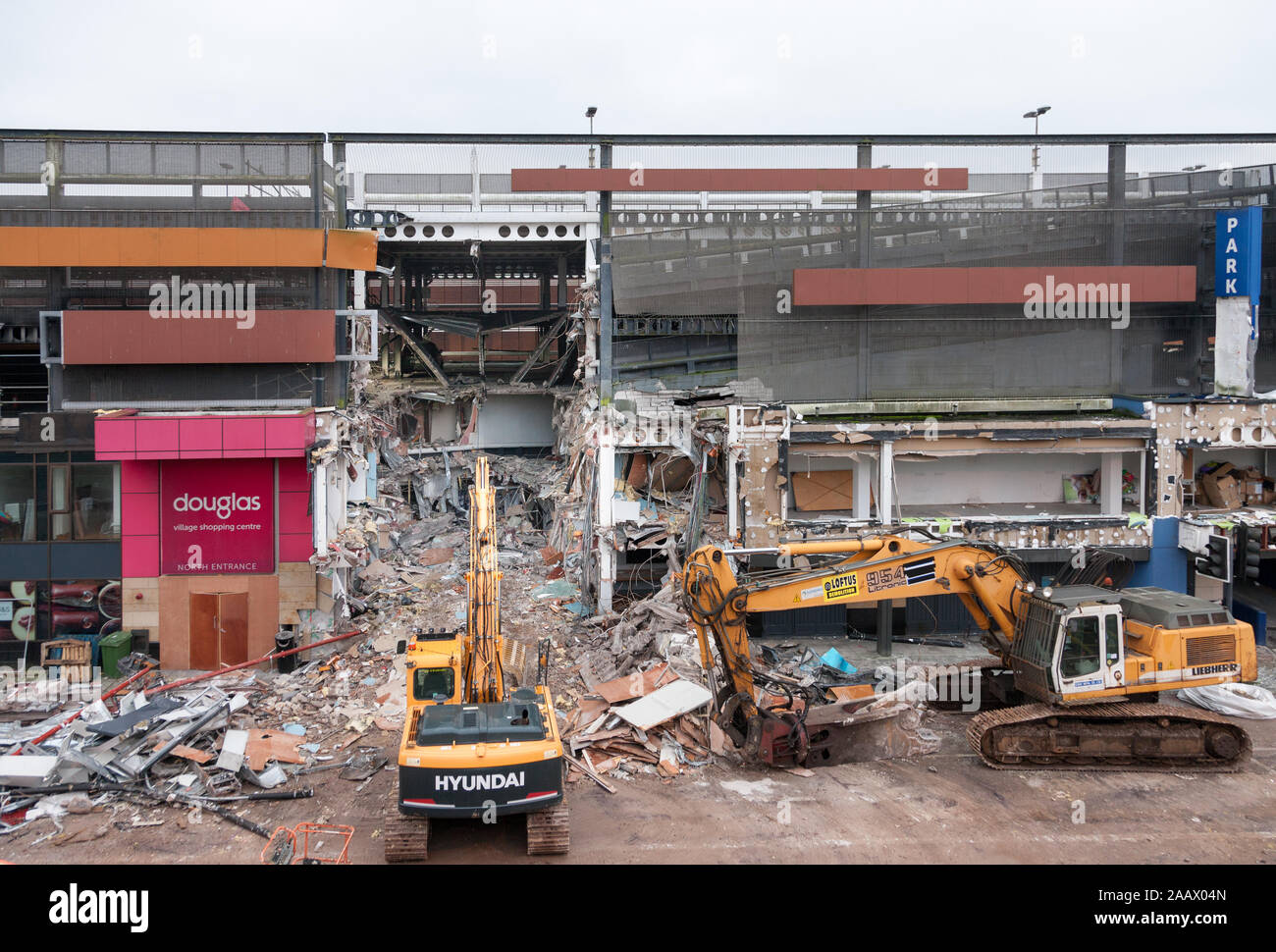 Douglas, Cork, Ireland. 24th November, 2019. Demolition works has started on the Douglas Village Shopping Centre in Cork after a major fire at the end of August. The Centre was forced to close when a car caught fire on the first floor of the multi-storey car park and quickly spread to other vehicles, resulting in extensive structural damage. Credit; David Creedon/Alamy Live News Stock Photo