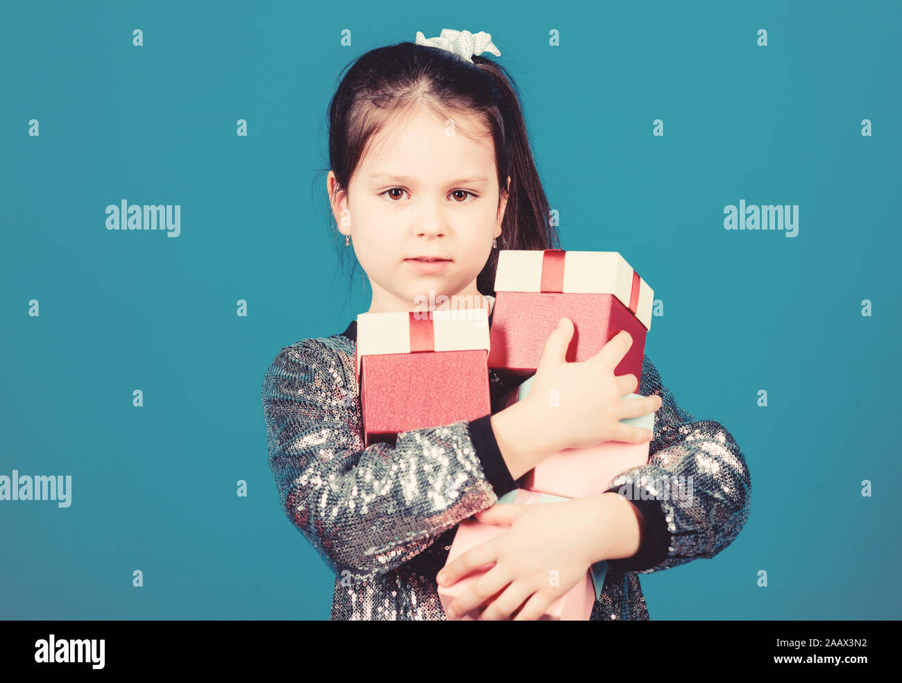 Special happens every day. Girl with gift boxes blue background. Black friday. Shopping day. Child carry lot gift boxes. Surprise gift box. Birthday wish list. World of happiness. Only for me. Stock Photo
