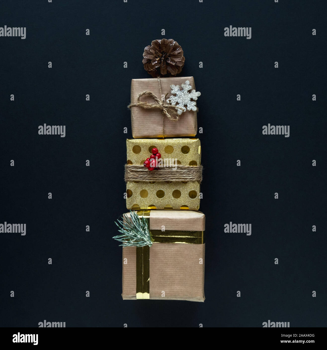 Three beautiful Christmas gift boxes on black background Stock Photo