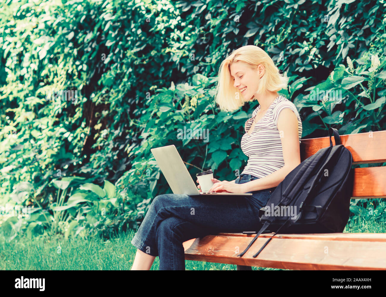 student girl study online. student prepare for exams. students life. Pretty woman. online education. modern woman student study online outdoor. happy woman work on laptop. Congratulations. Stock Photo