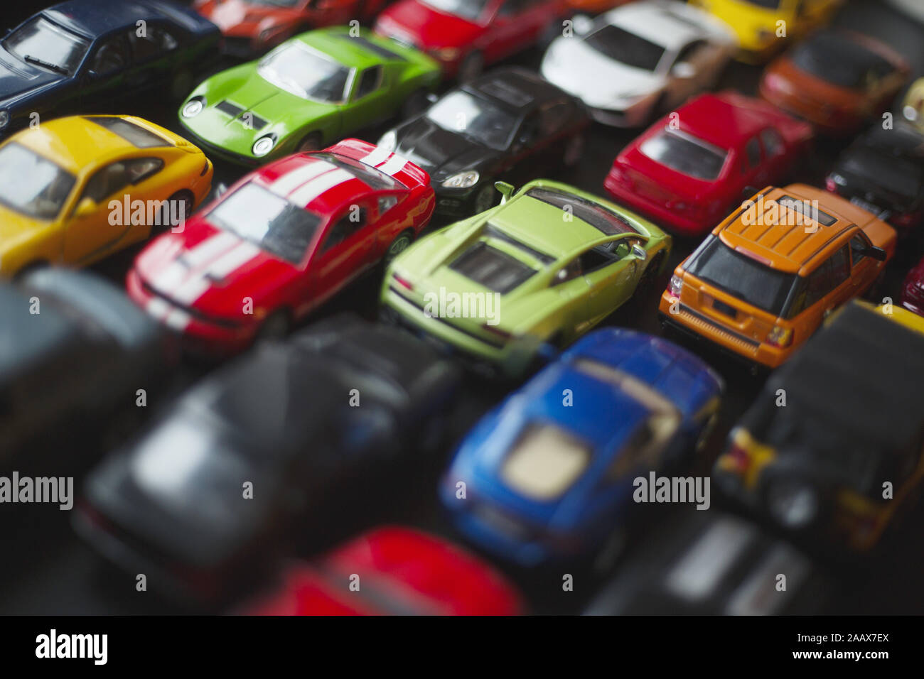 Traffic jam of toy cars, many cars standing in a line urban problems