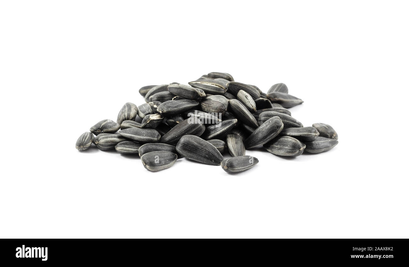 Sunflower seeds in a pile isolated on white Stock Photo - Alamy