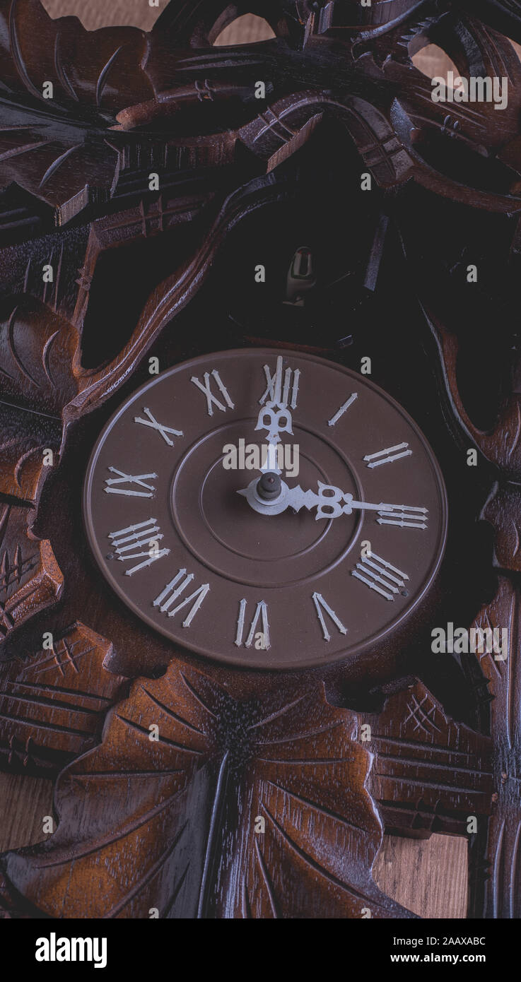 Cuckoo clock hanging on a rustic wooden wall Stock Photo Alamy