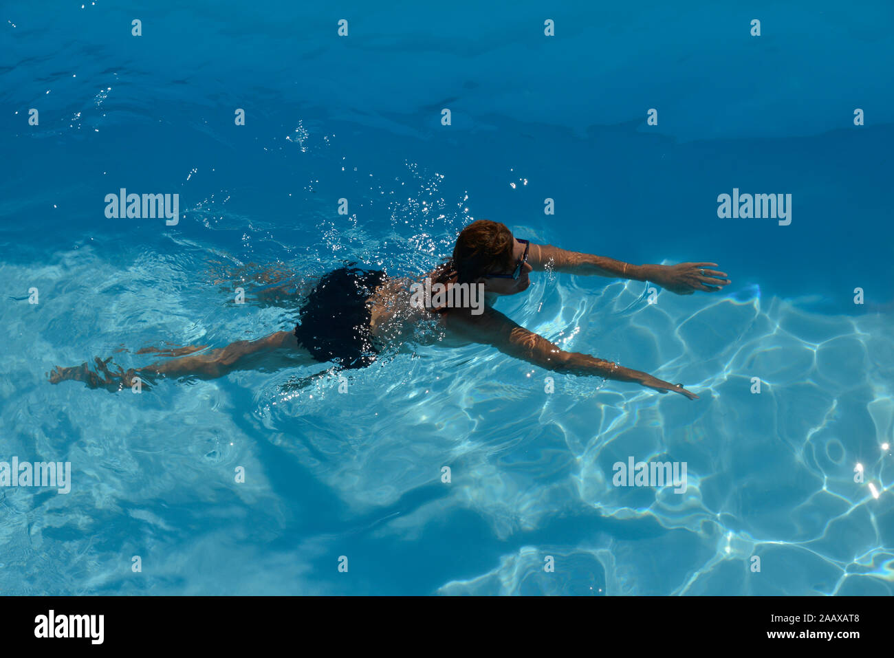 Woman swimming in pool water hi-res stock photography and images - Alamy