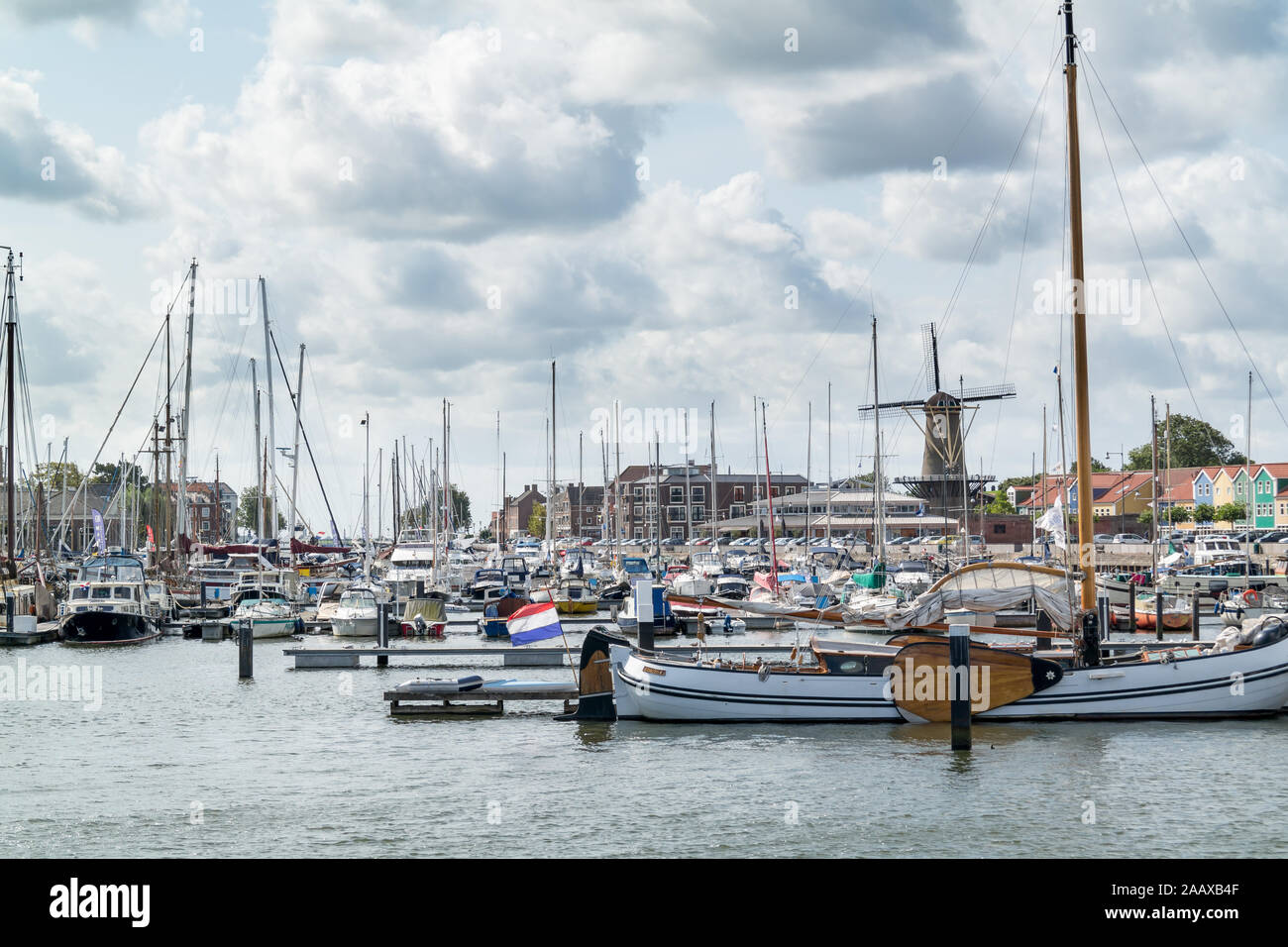 Yachts and windmill in the harbour of Hellevoetsluis, Netherlands Stock Photo