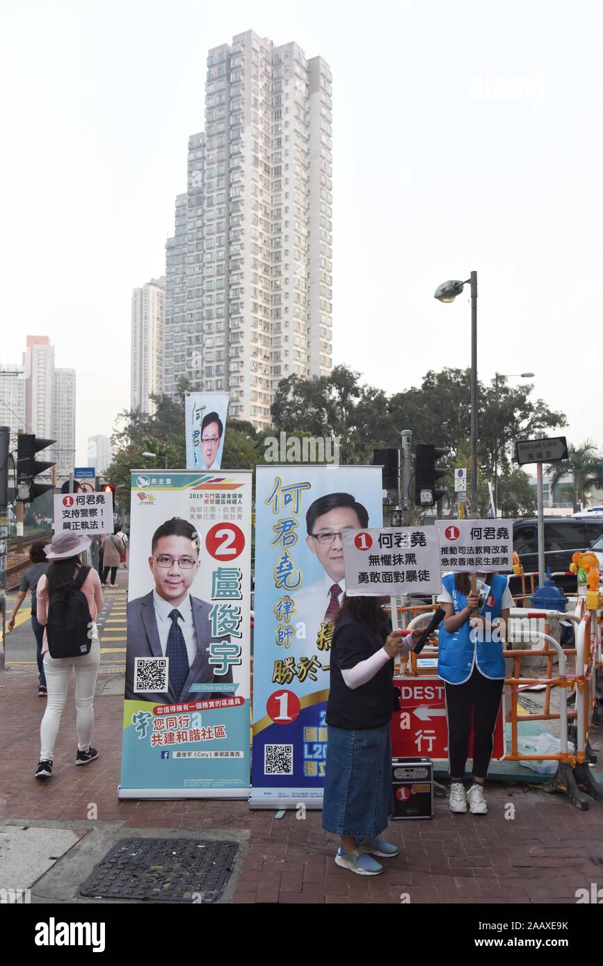 Volunteers campaign on a street ahead of District Council Elections. Hong Kong held its district council election under a rare atmosphere of calm and peace after weeks of intense clashes at numerous universities between anti-government protesters and police which continue into its sixth month of demonstrations. Stock Photo