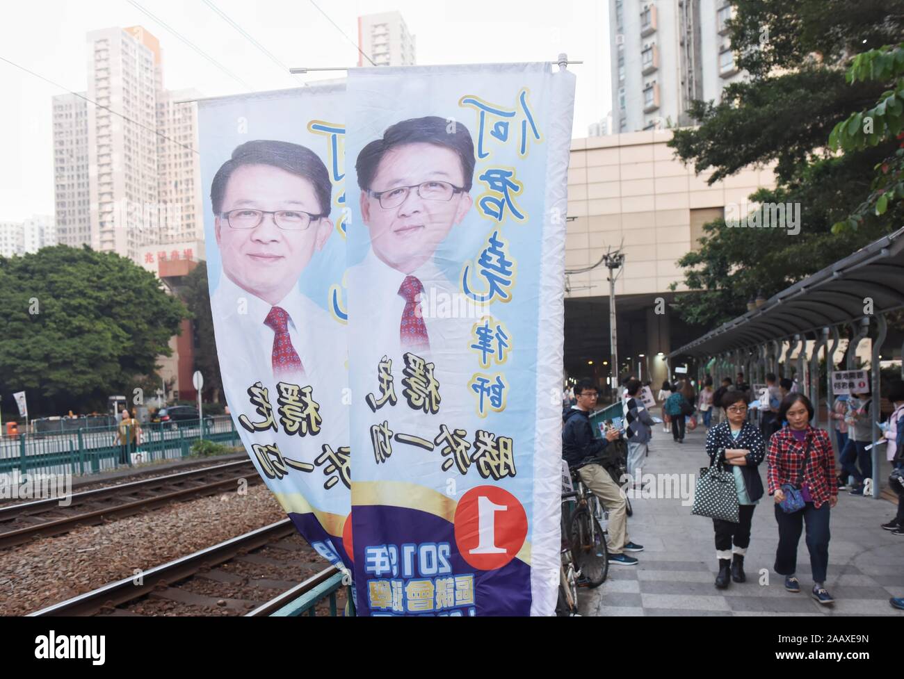 Banners of pro-establishment lawmaker candidate Junius Ho are seen in Tuen Mun district ahead of District Council Elections. Hong Kong held its district council election under a rare atmosphere of calm and peace after weeks of intense clashes at numerous universities between anti-government protesters and police which continue into its sixth month of demonstrations. Stock Photo