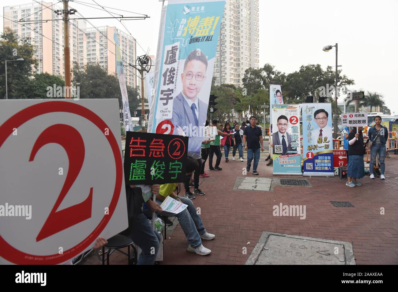 Volunteers campaign on a street ahead of District Council Elections. Hong Kong held its district council election under a rare atmosphere of calm and peace after weeks of intense clashes at numerous universities between anti-government protesters and police which continue into its sixth month of demonstrations. Stock Photo