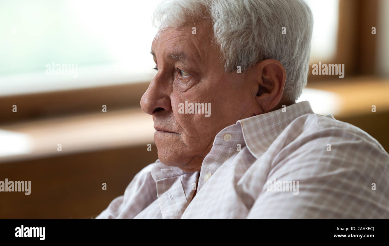 Upset depressed elder male pensioner feeling lonely. Stock Photo