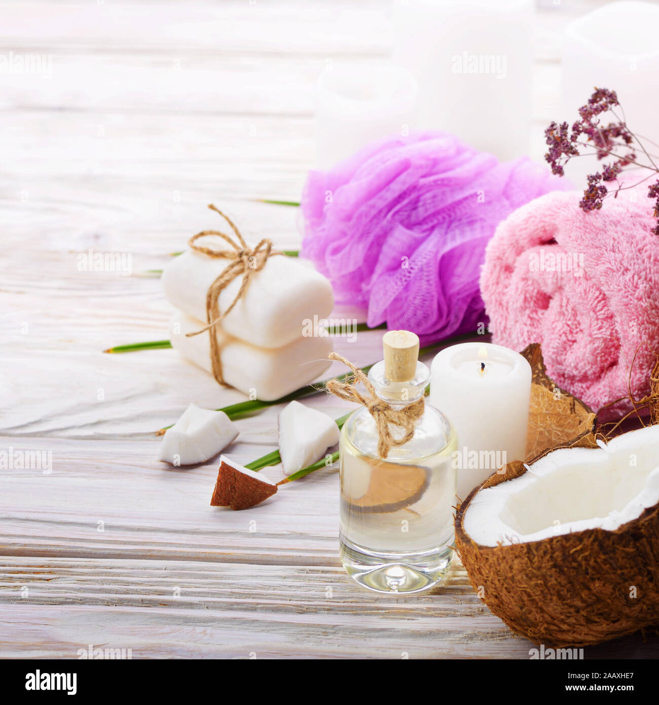 Body care Coconut oil soap and candle set on white table Stock Photo