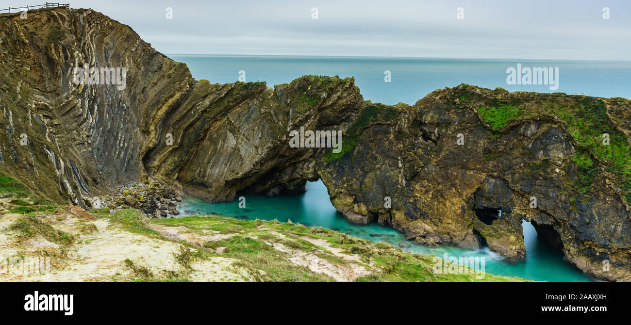 Stair Hole is a small cove is just west of Lulworth Cove in Dorset, southern England, the folded limestone strata is known as the Lulworth crumple. Stock Photo