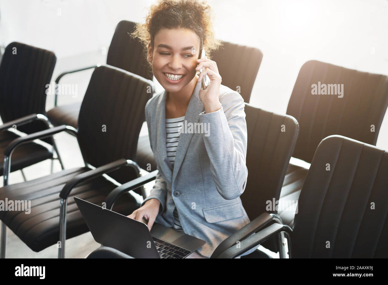 Young woman working in empty conference room Stock Photo