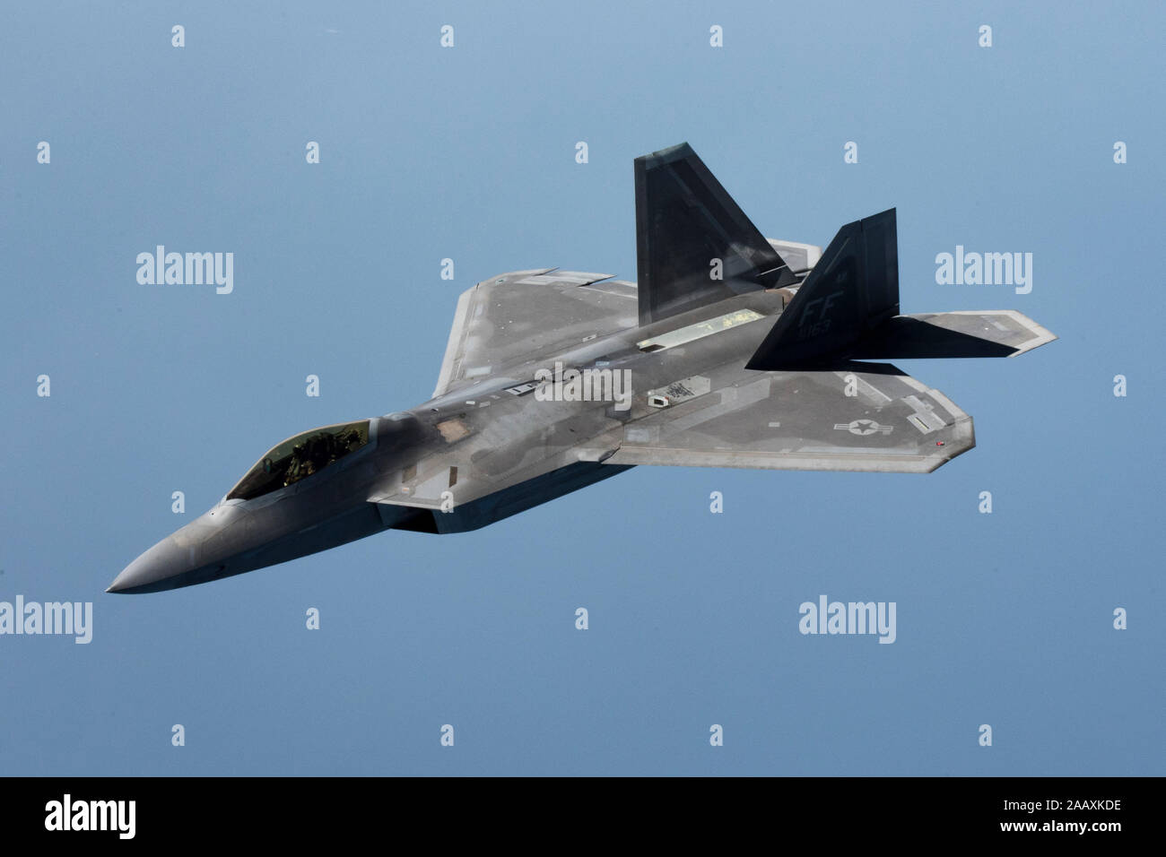 A U.S. Air Force F-22 Raptor departs after being refueled by a 28th Expeditionary Air Refueling Squadron KC-135 Stratotanker during a mission in the U.S. Central Command area of operations, Oct. 25, 2019. The Raptor plays a key role in U.S. Air Forces Central Command operations by maintaining constant readiness in support of air operations, providing deterrence and stability, and bolstering the mission efforts of coalition partners. (U.S. Air Force photo by Master Sgt. Russ Scalf) Stock Photo