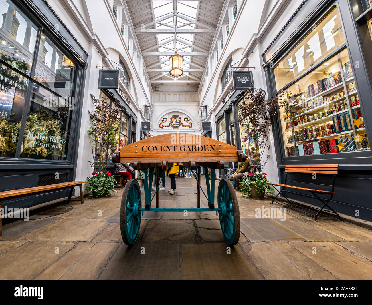 London, England, UK -  November 15, 2019: Vintage horse carriage in the old town square hall of Covent Garden in winter Christmas holiday Stock Photo