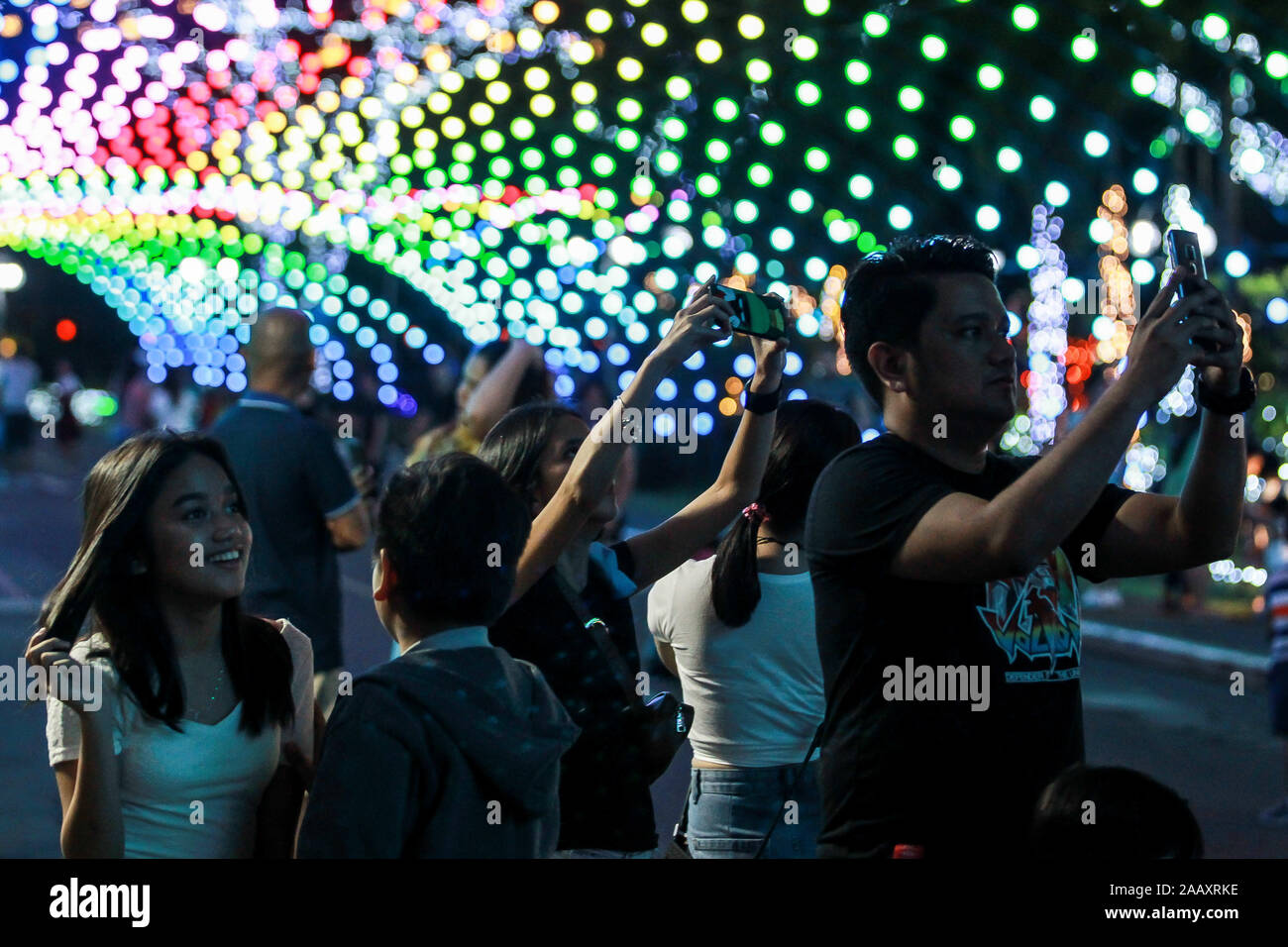 Quezon City, Philippines. 24th Nov, 2019. Visitors look at colorful