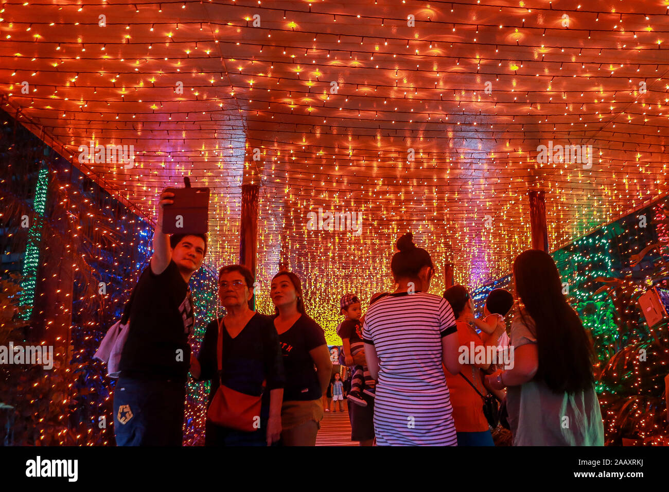 Quezon City, Philippines. 24th Nov, 2019. Visitors look at colorful