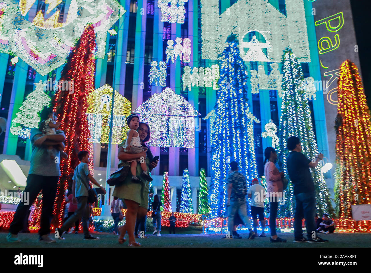 Quezon City, Philippines. 24th Nov, 2019. Visitors look at colorful