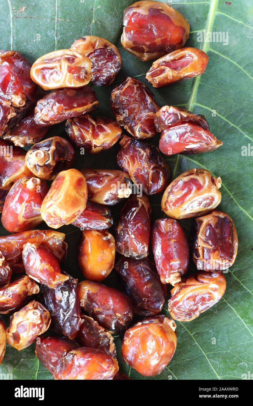 Abstract background of sweet honey dates on the market close up