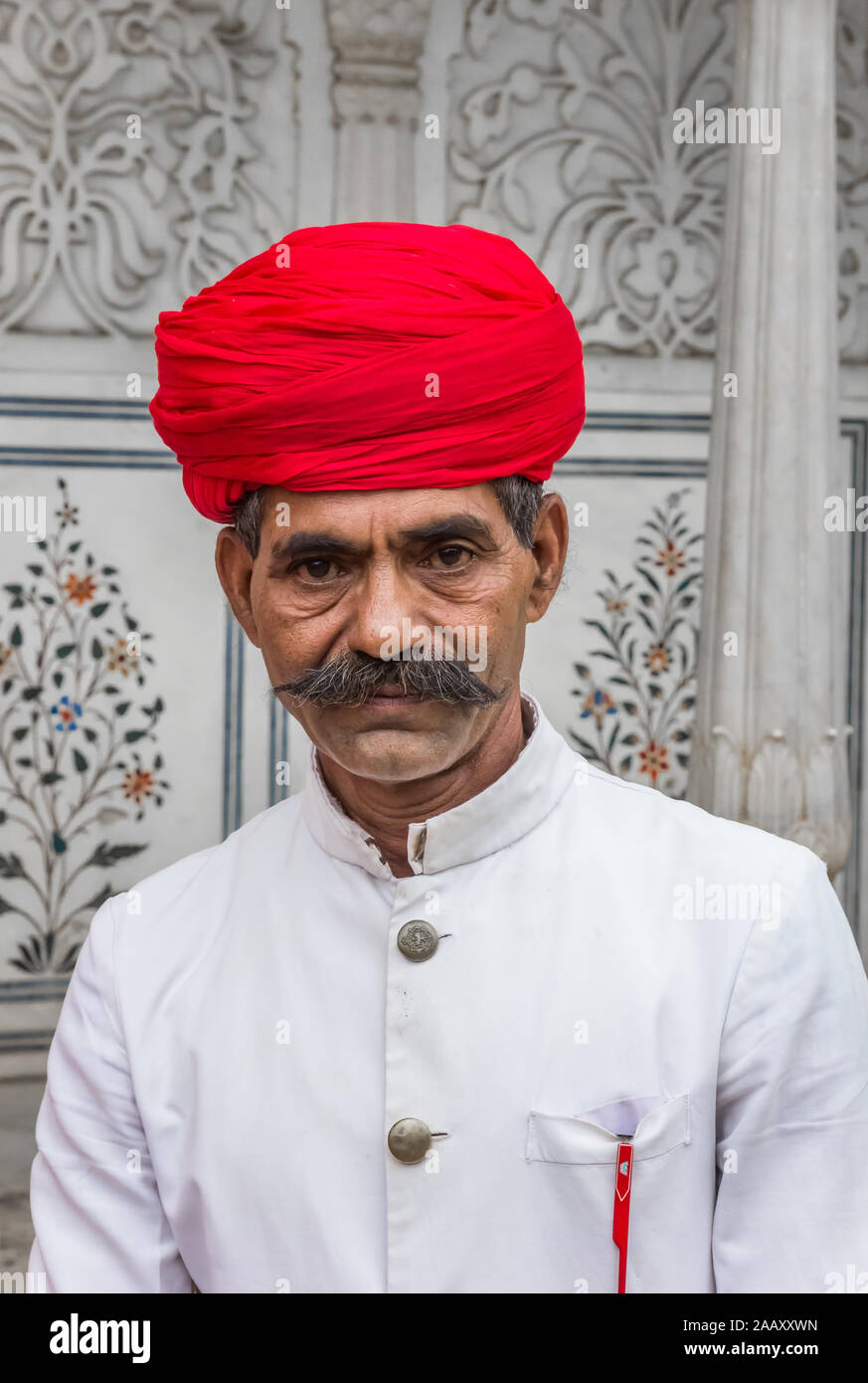 Portrait of a man with moustache and turban in the city palace of Jaipur, India Stock Photo
