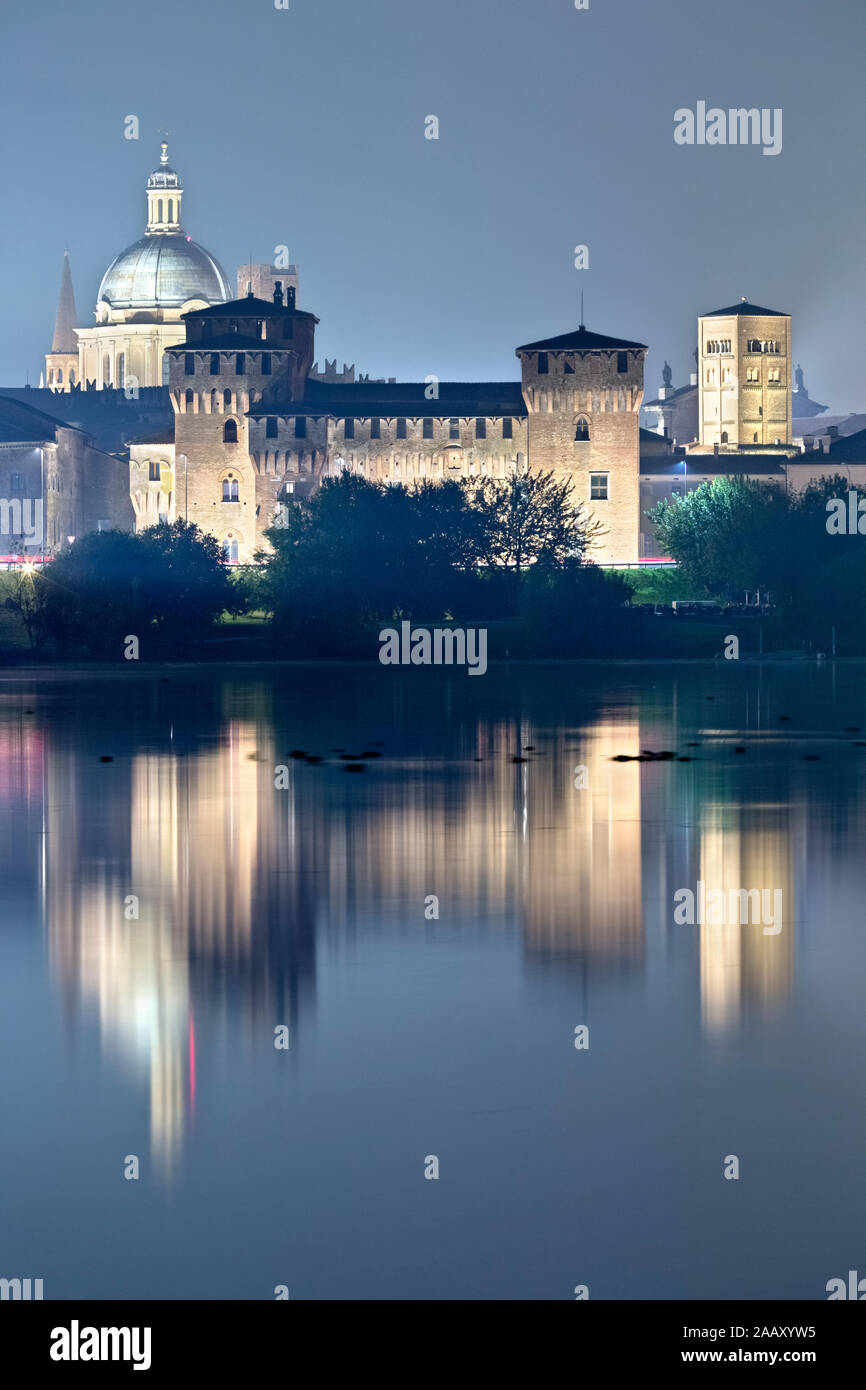 Mantova is reflected on the middle lake of the Mincio river. The city is one of the main centers of the Italian and European Renaissance. Italy. Stock Photo