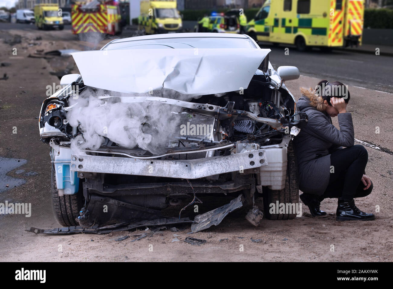 Woman after car accident in the city. Car crash from car accident on the road. Stock Photo