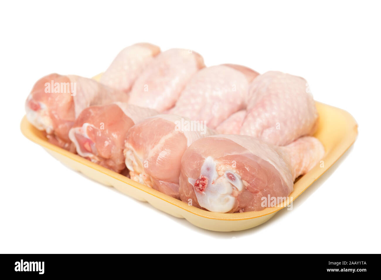 Download Raw Chicken Legs In A Yellow Plastic Tray Isolated On White Background Stock Photo Alamy PSD Mockup Templates