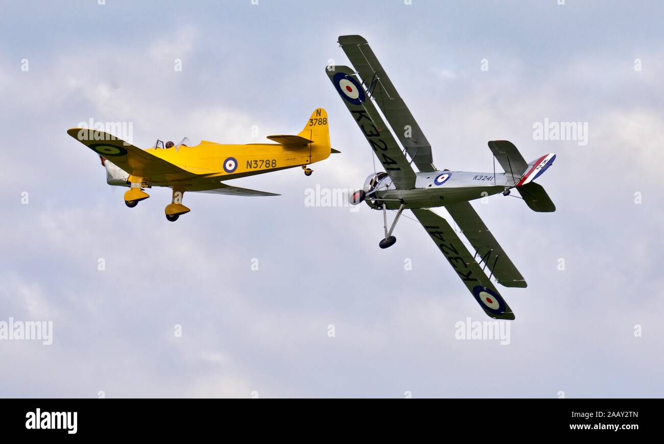 Avro 621 Tutor and the Miles Magister flying together at the Shuttleworth Evening Airshow on the 18th May 2019 Stock Photo