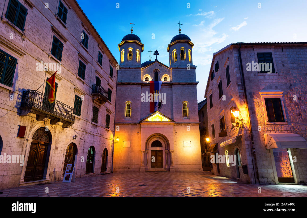 Illuminated Church of Saint Nicholas in Old Town of Kotor at sunrise, Montenegro Stock Photo