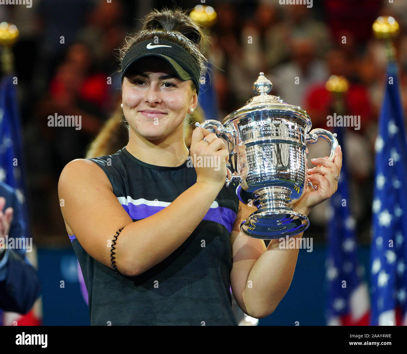 Canadian tennis player Bianca Andreescu holding trophy during