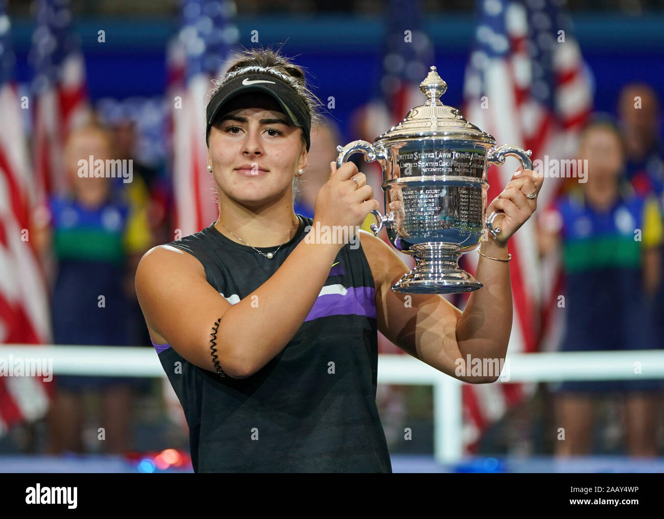 Canadian tennis player Bianca Andreescu holding trophy during