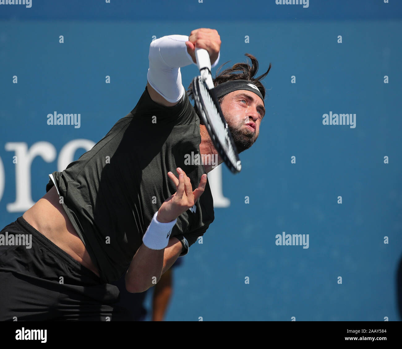 Georgian tennis player Nikoloz Basilashvili (GEO) serving during 2019 US Open tennis tournament, New York City, New York State, USA Stock Photo