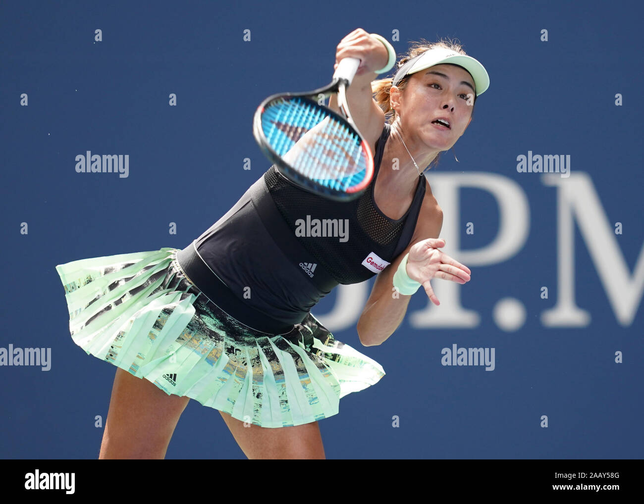 Chinese tennis player Qiang Wang serving during 2019 US Open tennis tournament, New York City, New York State, USA Stock Photo
