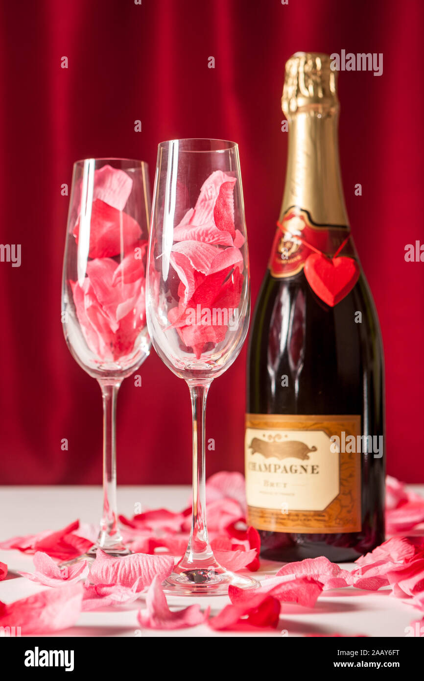 Love and Valentines: Bottle of champagne and glasses for two. Stock Photo