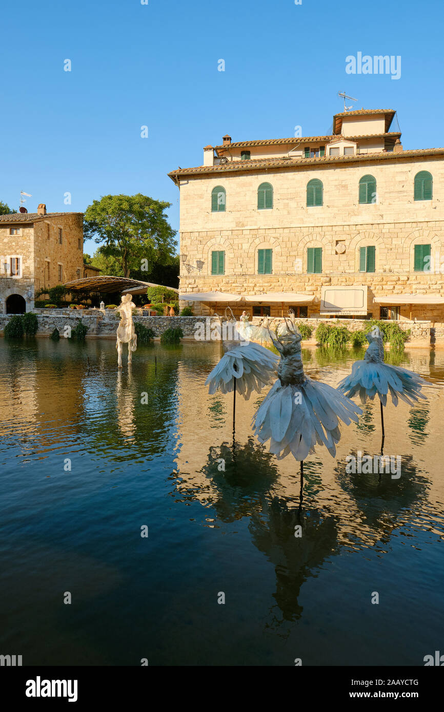Davide Dall'Osso's 'The Secret Garden' summer 2019 exhibit in the thermal pool of the spa village Bagno Vignoni in Val d'Orcia in Tuscany  Italy Stock Photo